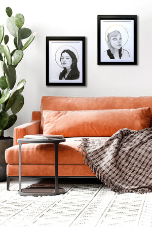 2 woman halo portrait drawings over sofa
