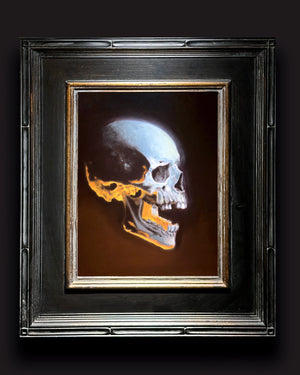glowing skull oil painting in frame
