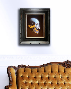 skull oil painting hanging on wall