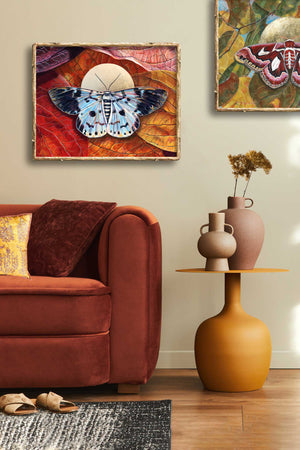 blue tiger moth leaves art print framed on wall
