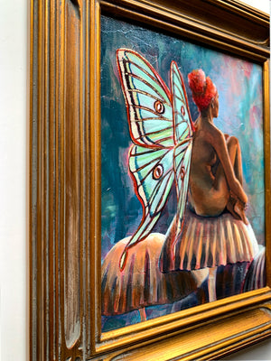 fairy painting with green wings and gold frame detail