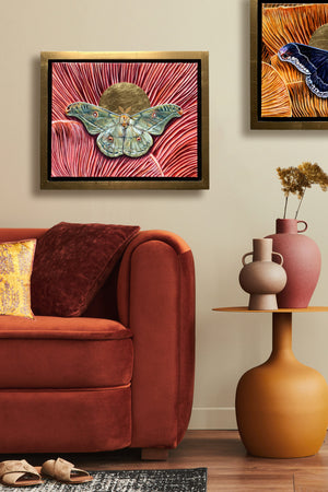 copaxia lavendera green moth mushroom painting in gold float frame hanging over sofa