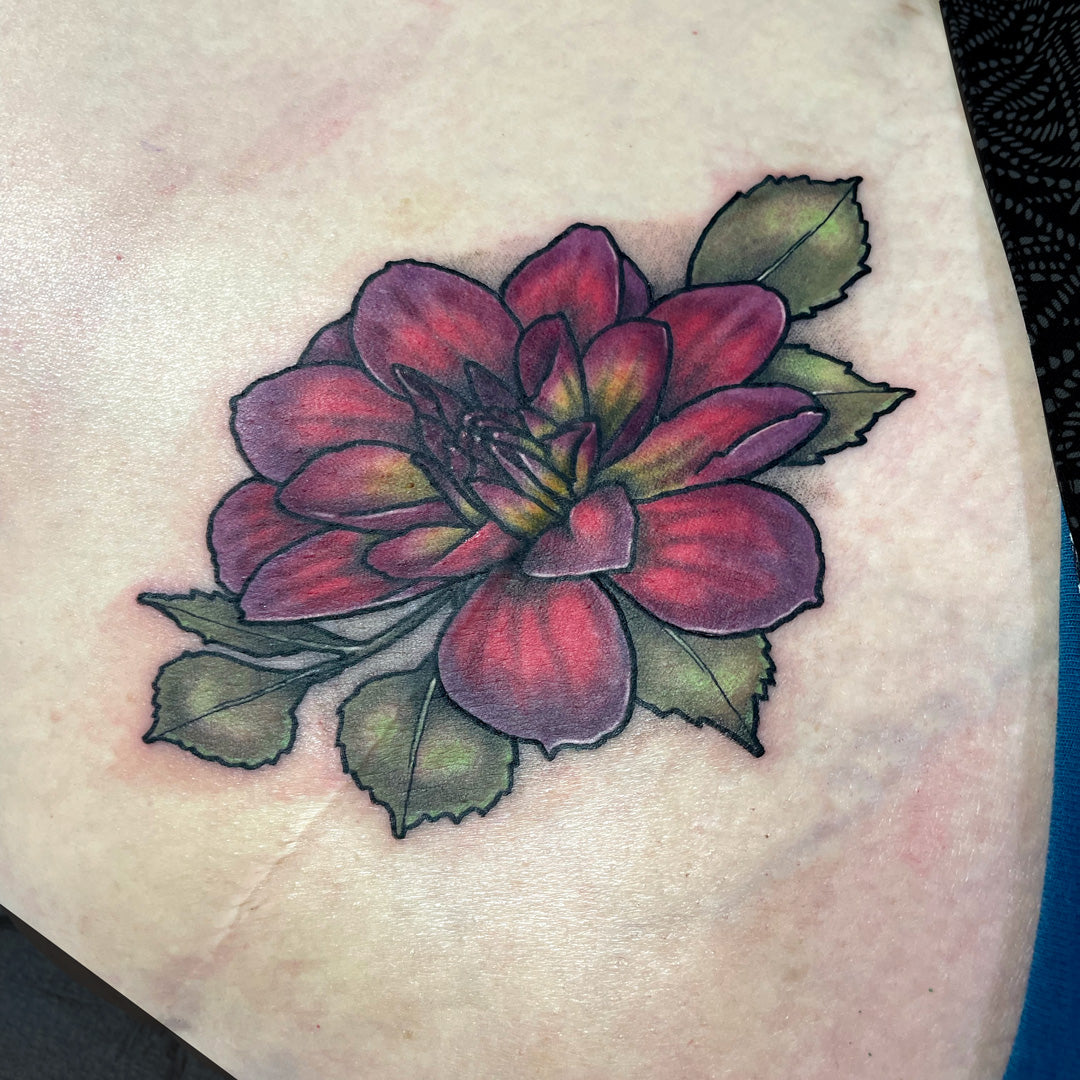 red flower tattoo scar coverup by Cass Brown