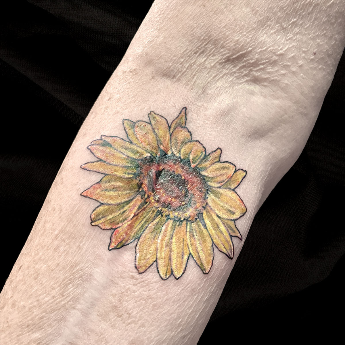 sunflower scar coverup tattoo by Cass Brown