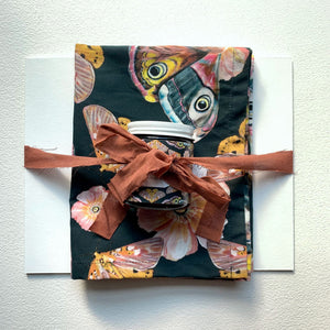 moonrise garden moth flower tea towel art print candle gift set