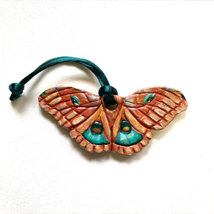pink and green moth ornament