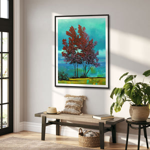 red tree teal clouds landscape art print framed on wall in entryway