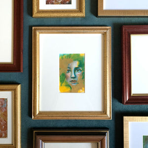 we are wonders and worlds emotional art colorful green, yellow and gold acrylic painting in vintage gold frame on teal gallery wall Aimee Schreiber