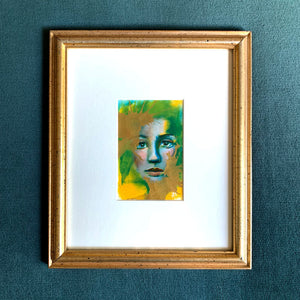 we are wonders and worlds emotional art colorful green, yellow and gold acrylic painting in vintage gold frame on teal wall Aimee Schreiber