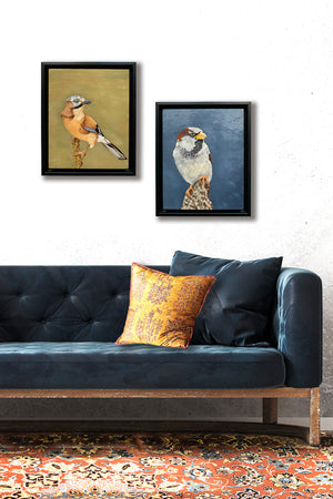 2 bird oil paintings hanging on wall