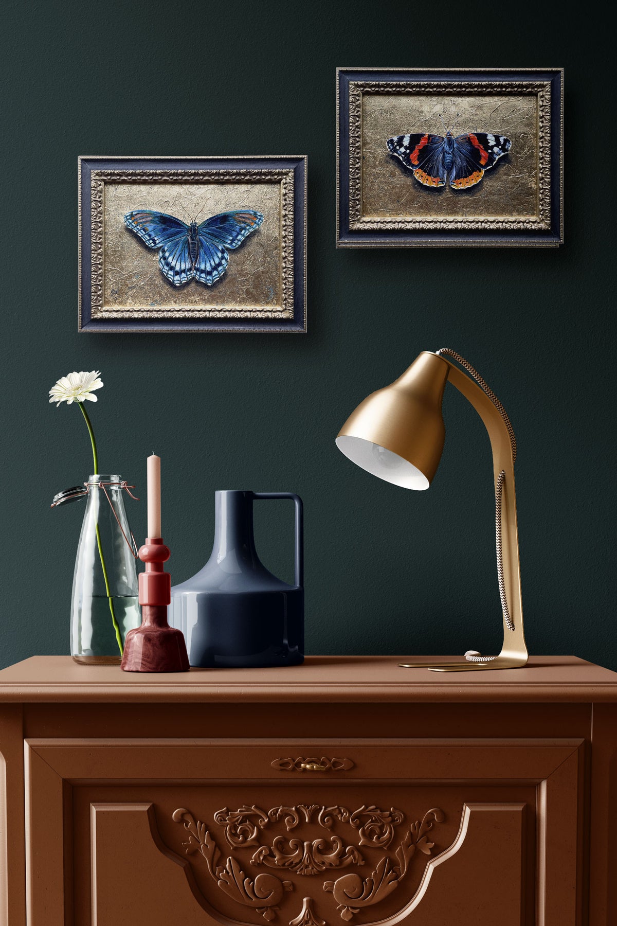 2 small gold butterfly paintings on wall