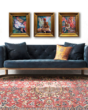 3 fairy paintings in gold frames hanging on wall over sofa