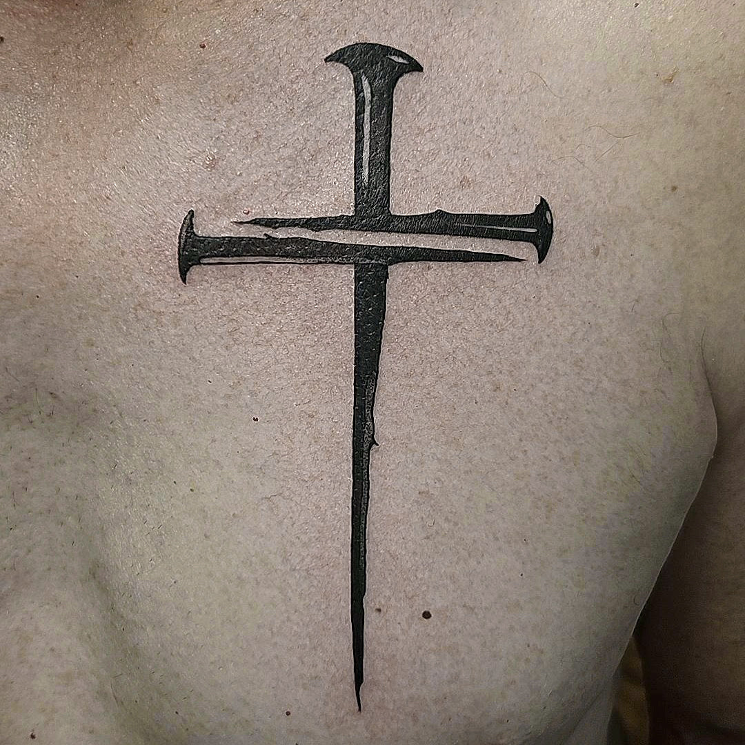 3 nail cross tattoo by Mary Kuzmin