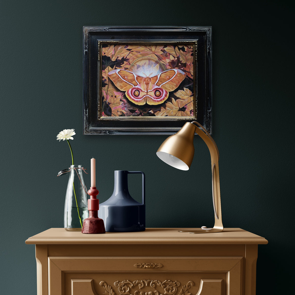 &#39;Entanglement&#39; antherina suraka moth painting in black frame on dark green wall