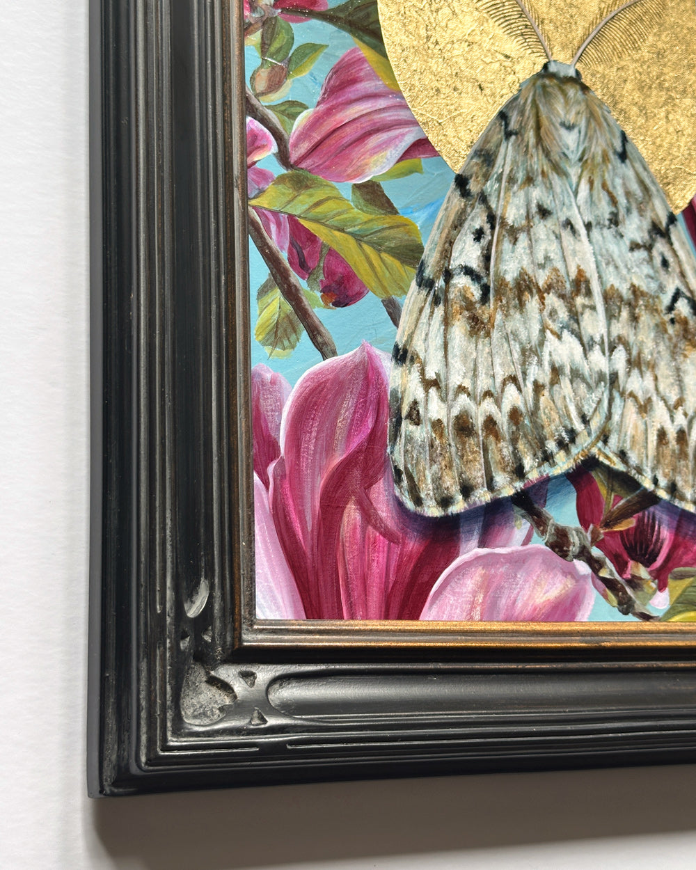 spongy moth and pink magnolia painting with gold leaf black frame detail