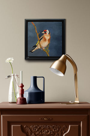 small oil painting of bird hanging over side table