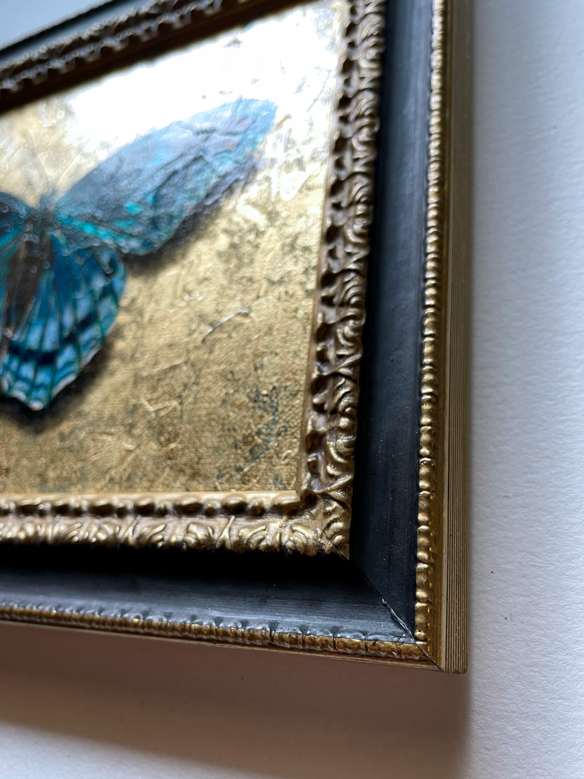 blue butterfly painting with gold leaf frame detail