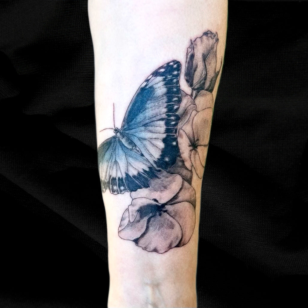 blue butterfly floral tattoo by Danny Schreiber