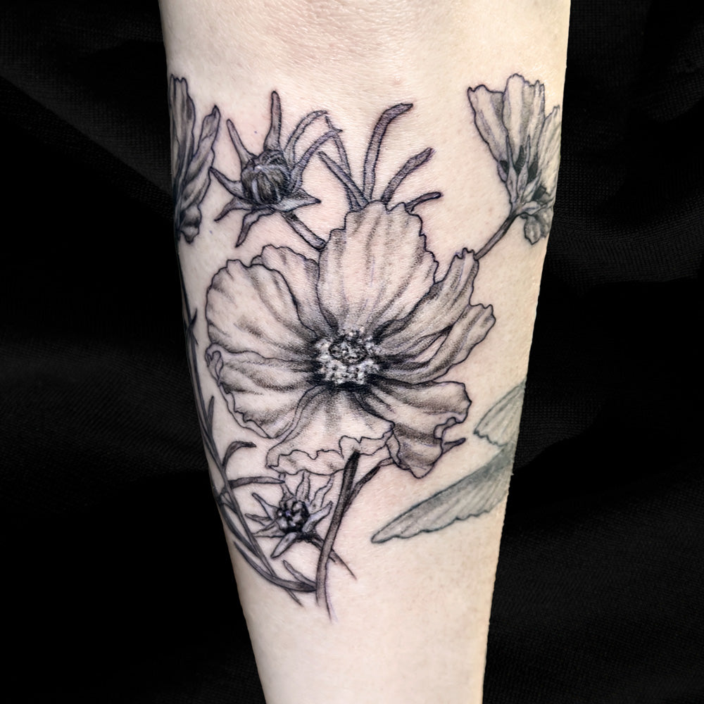 cosmo flower tattoo