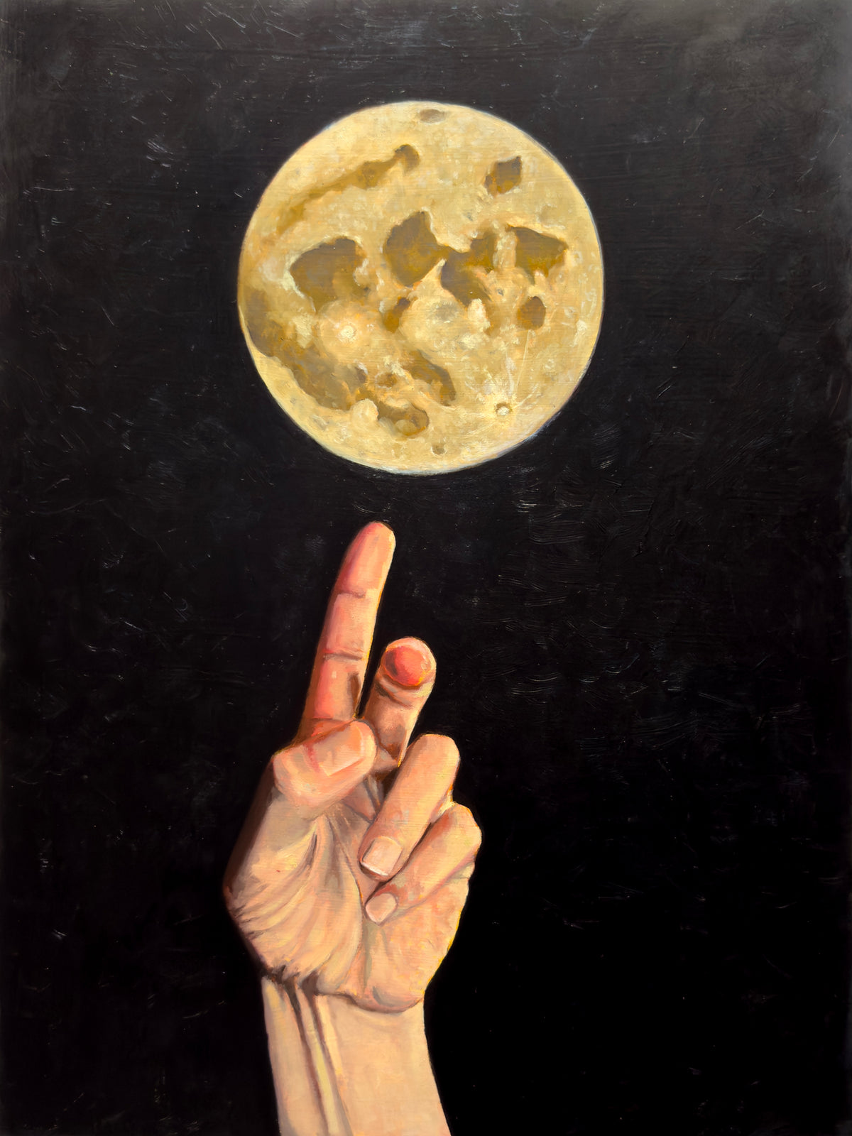 Hand reaching towards a golden full-moon against a dark background