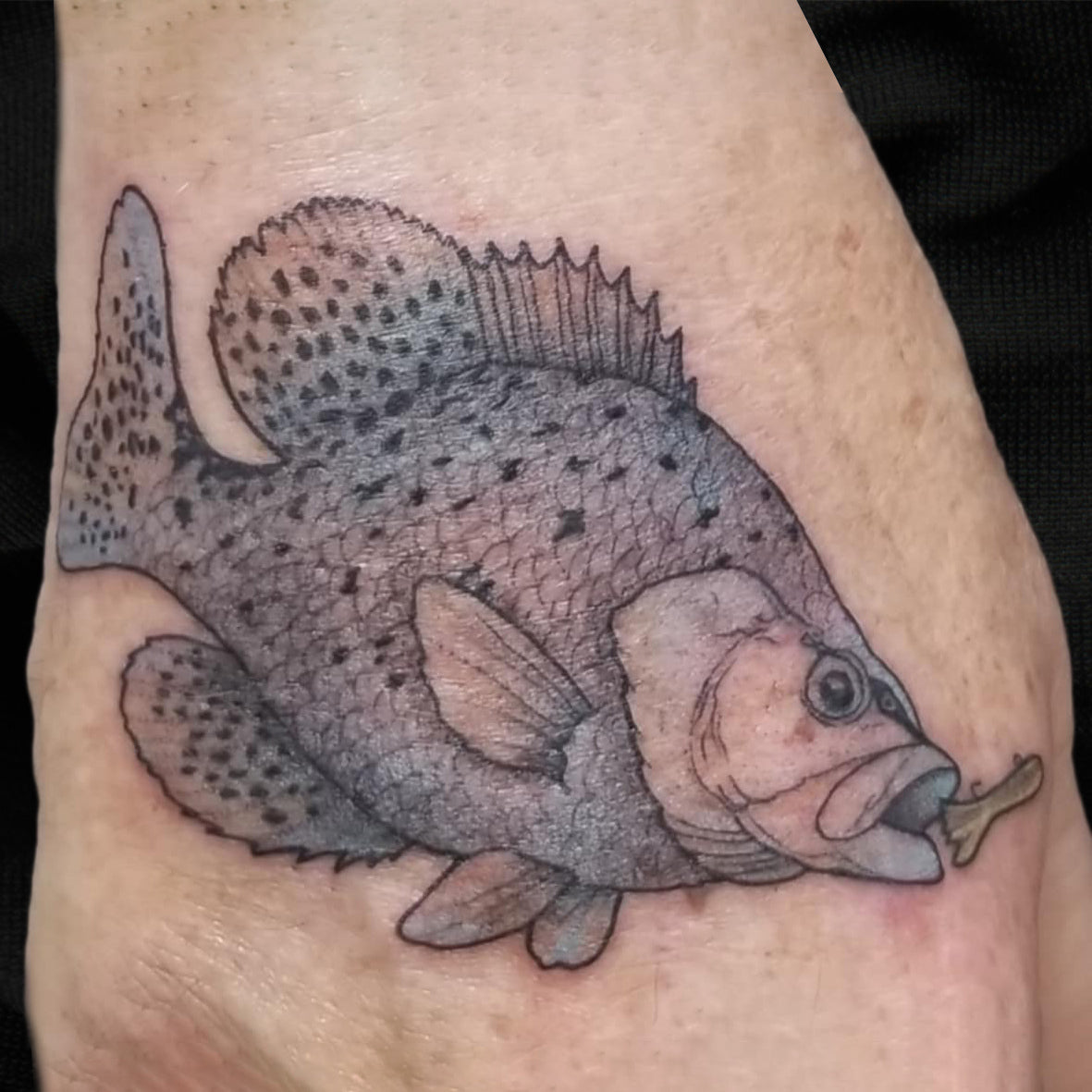 blue fish tattoo by Lydia