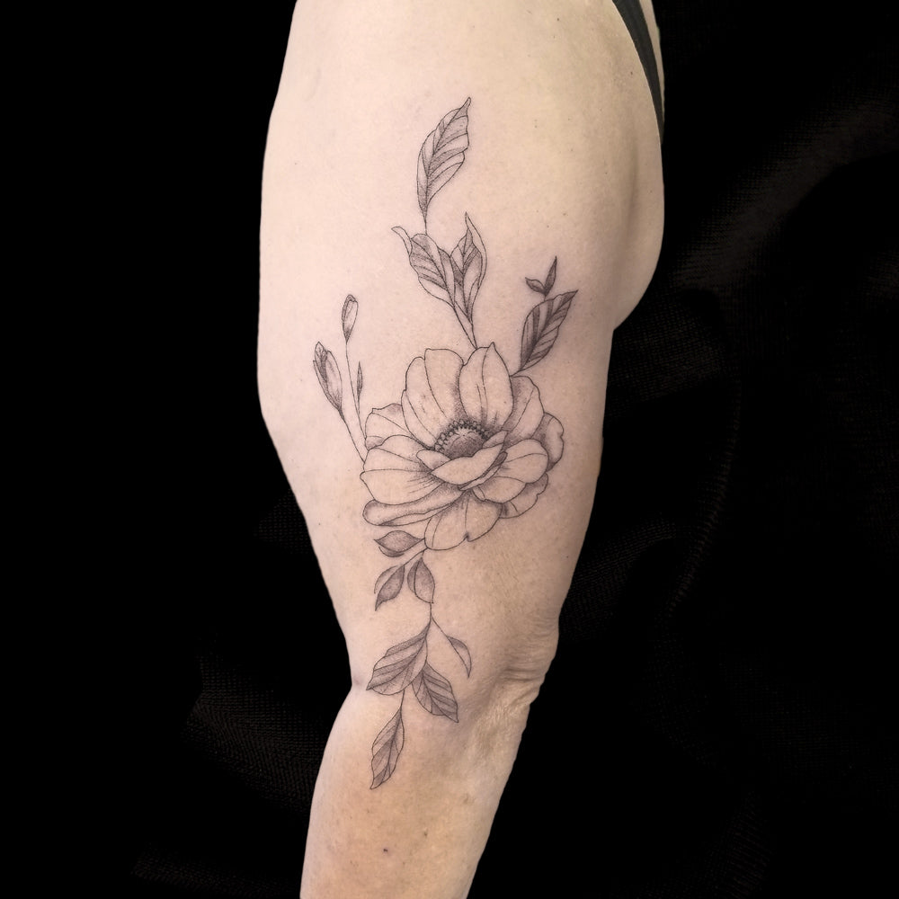 fine line flower tattoo by Lydia