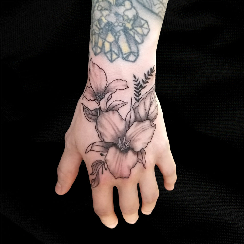 flower trillium hand tattoo by Lydia Pitts