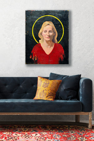 woman in red portrait painting with yellow halo hanging over sofa