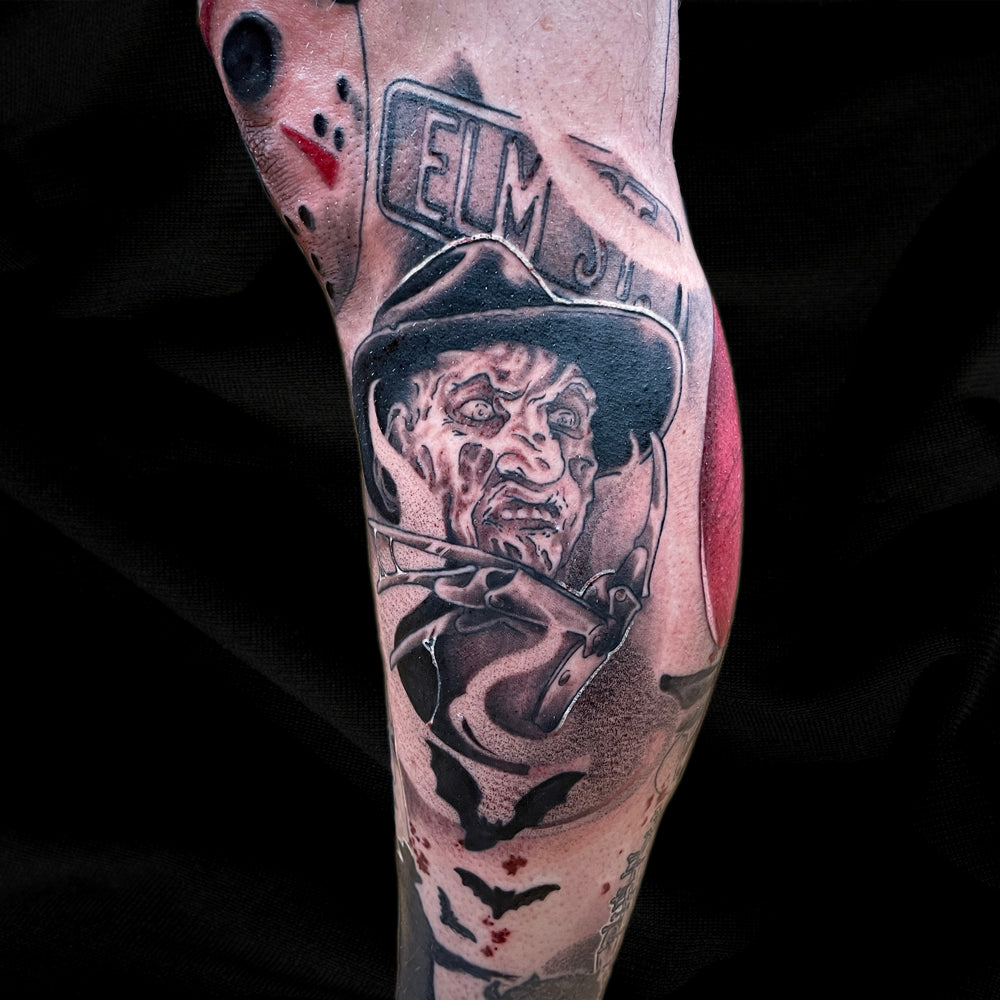 Freddy Krueger Halloween leg sleeve tattoo by Cass Brown