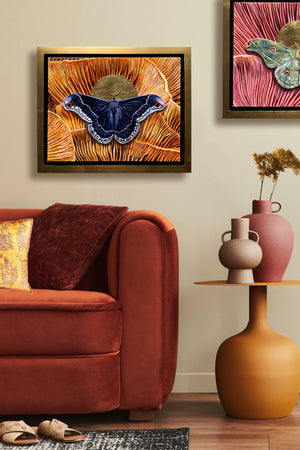 promethea moth mushroom painting in gold float frame hanging over sofa