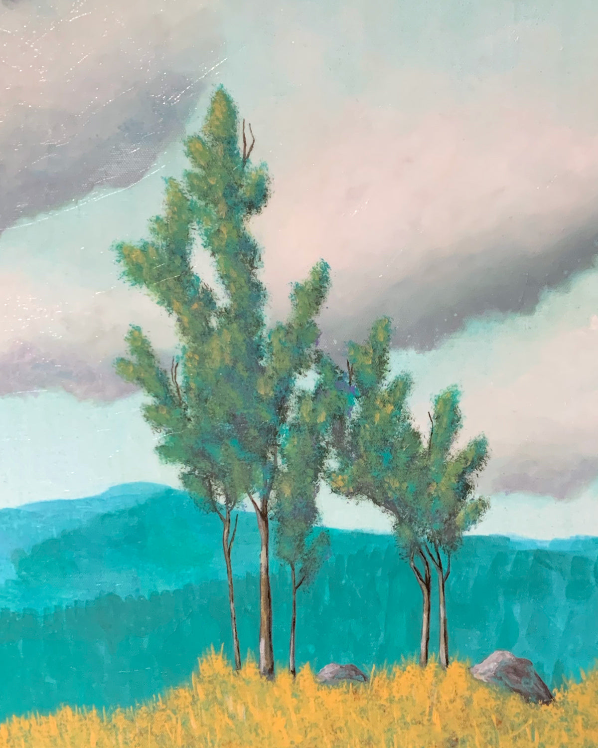 teal and yellow landscape painting with trees, clouds, and mountains detail
