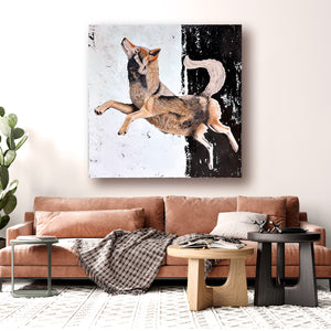 large wolf painting hanging over sofa