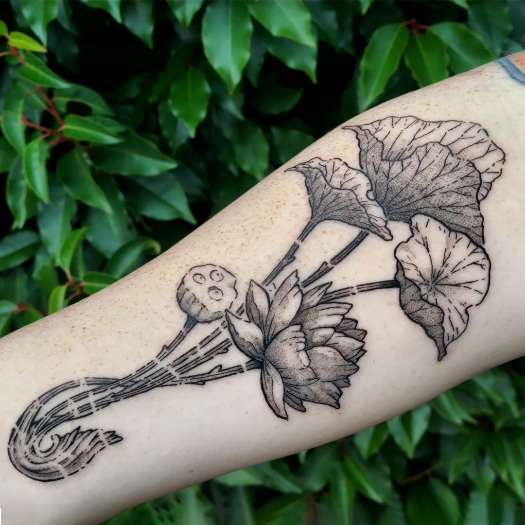 Lily and lotus tattoo by Vincent Li