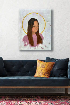 luminous portrait painting with halo on wall over sofa