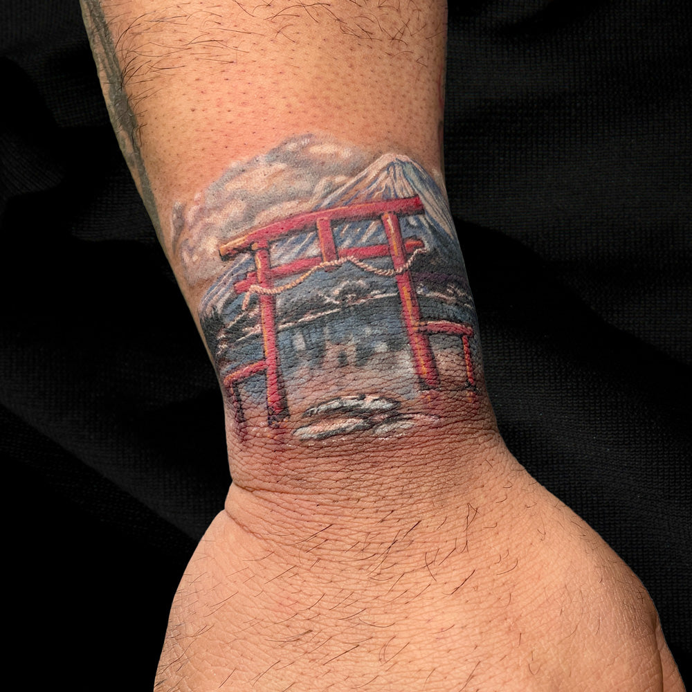 color Mt Fuji wrist tattoo by Cass Brown