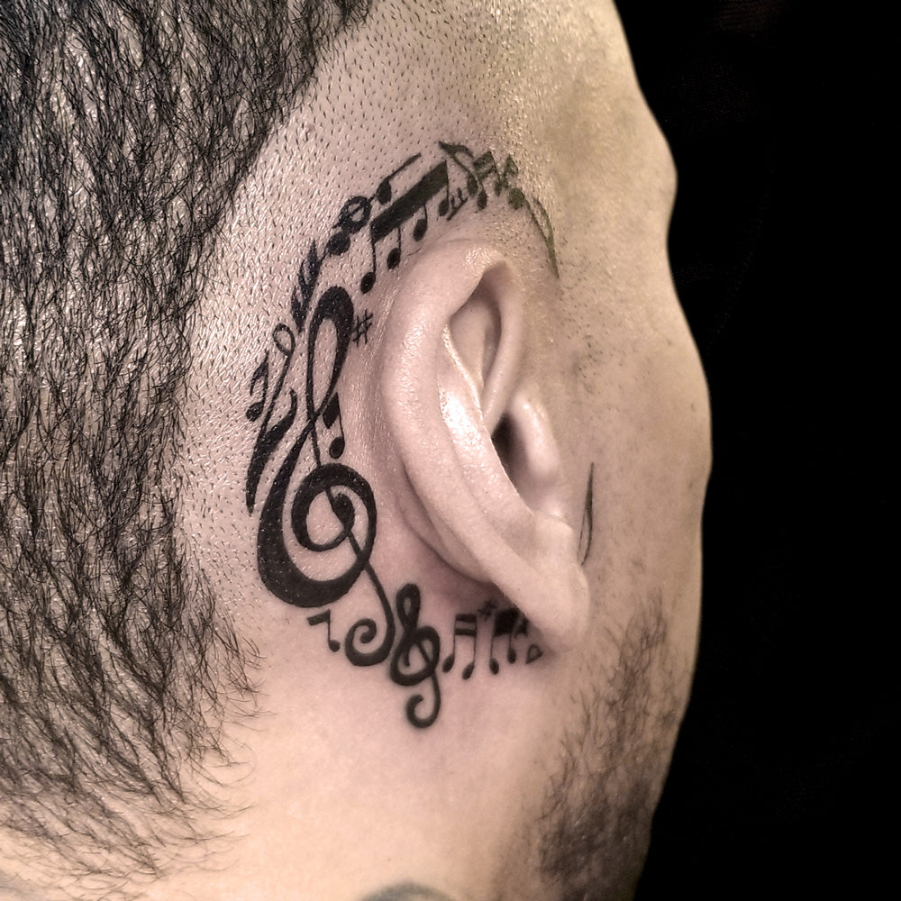 music notes head tattoo by Lydia Pitts