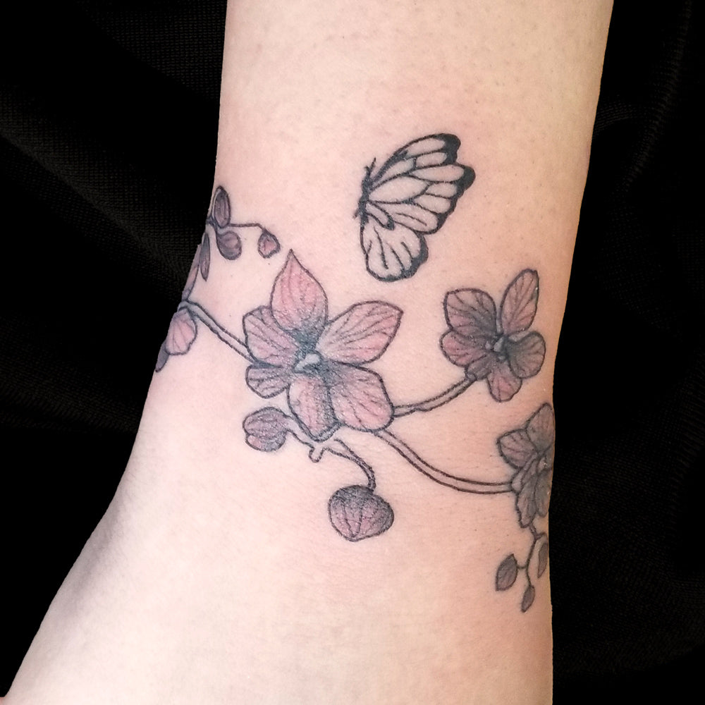 orchid butterfly wrist band tattoo