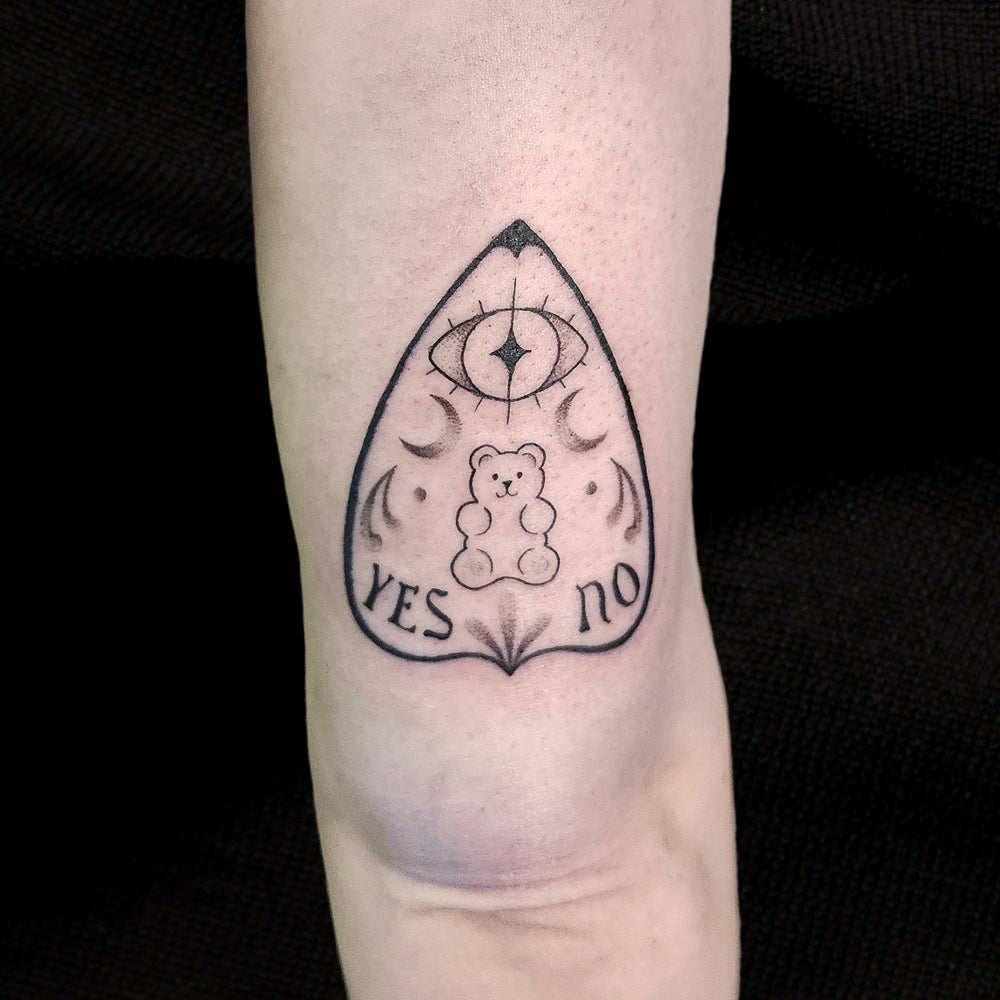 gummy bear ouija planchette tattoo by Lydia Pitts