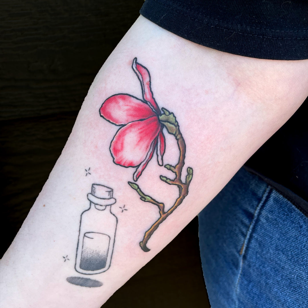 Pink magnolia blossom tattoo by Cass Brown