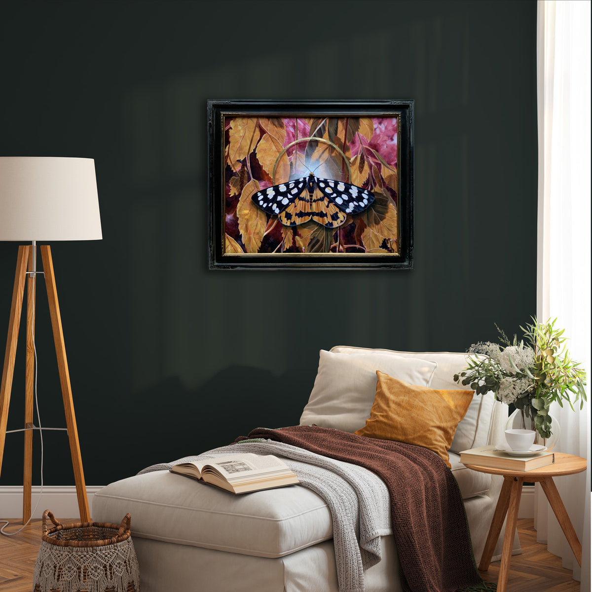 Ranchman&#39;s tiger moth painting hanging on dark green wall