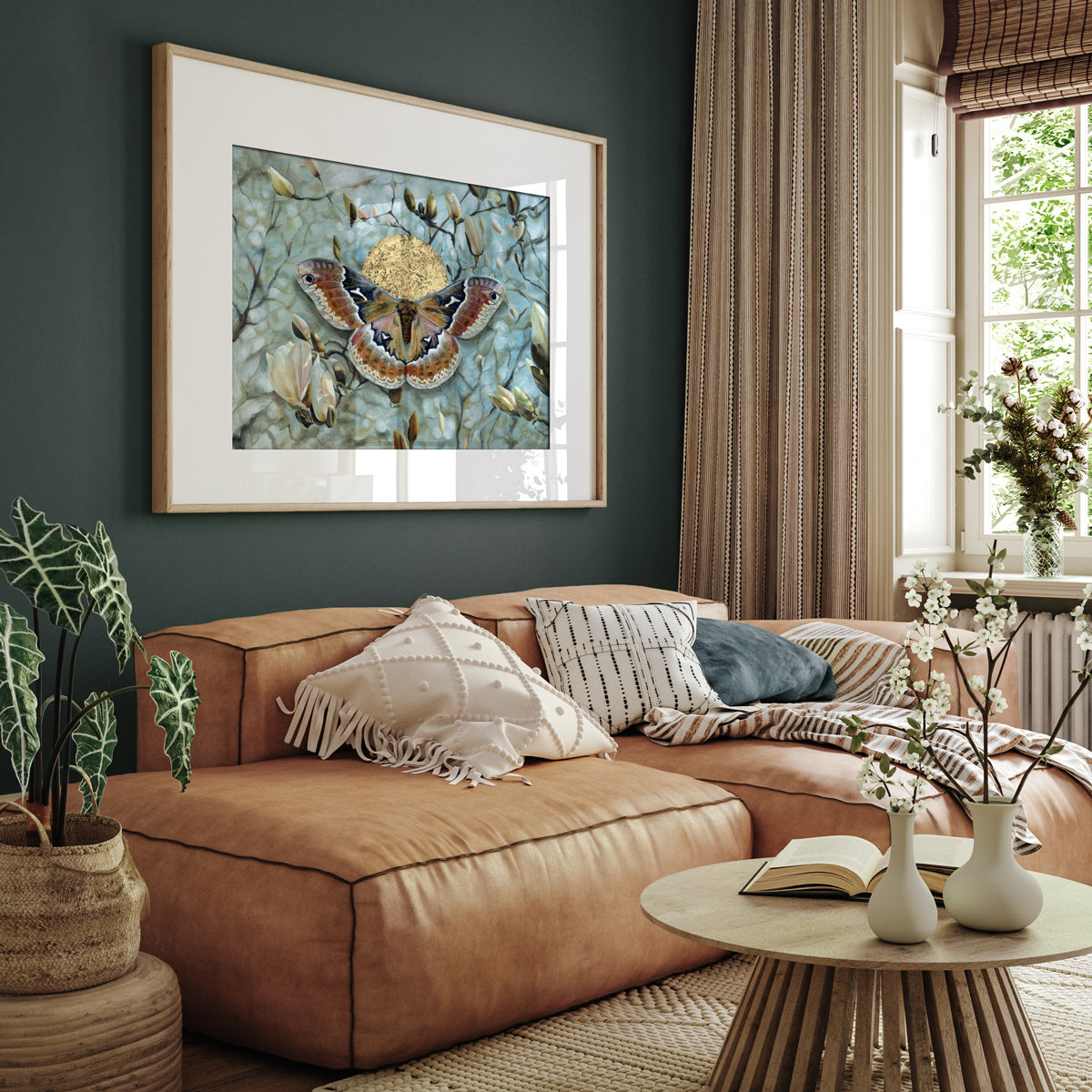 Tuliptree moth magnolia art print hanging over sofa