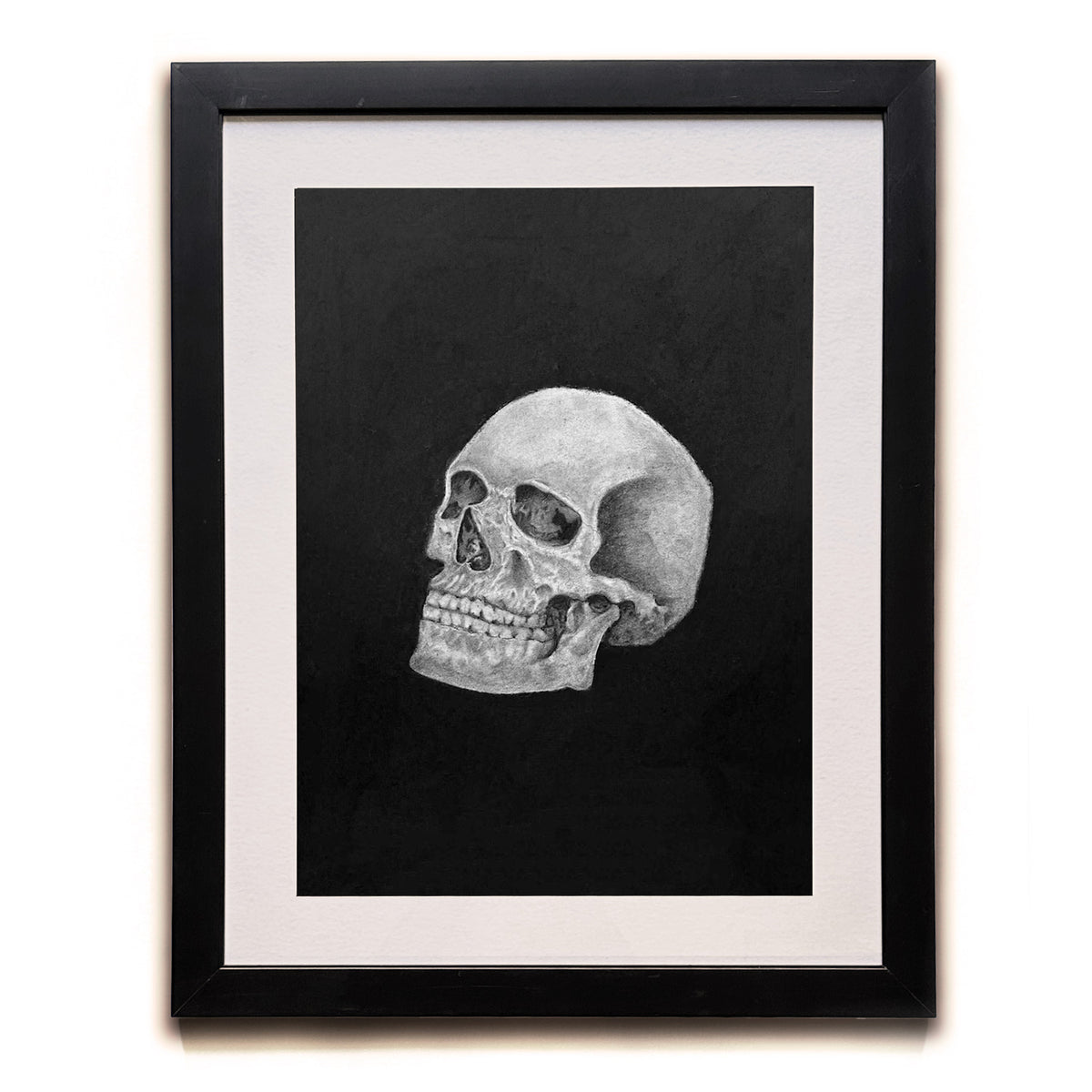 skull charcoal drawing in black frame