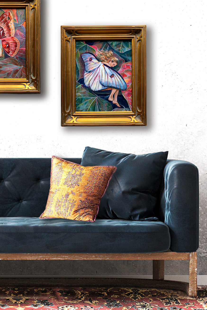 sleeping fairy painting in gold leaf frame on wall