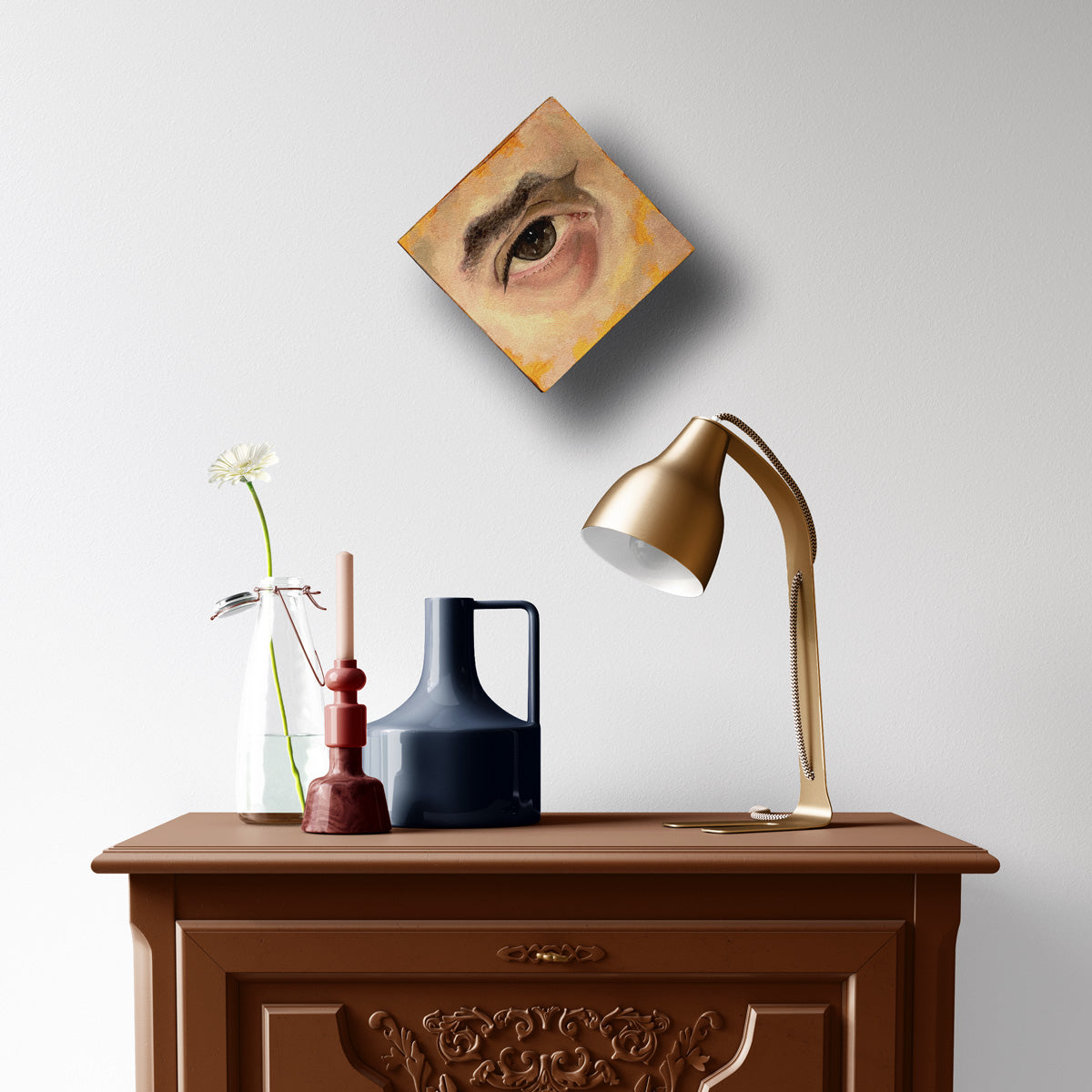 eye painting brown and yellow on wall