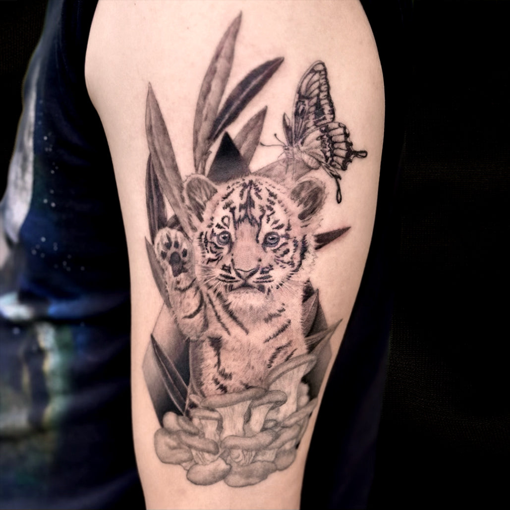 tiger cub butterfly tattoo by Danny Schreiber