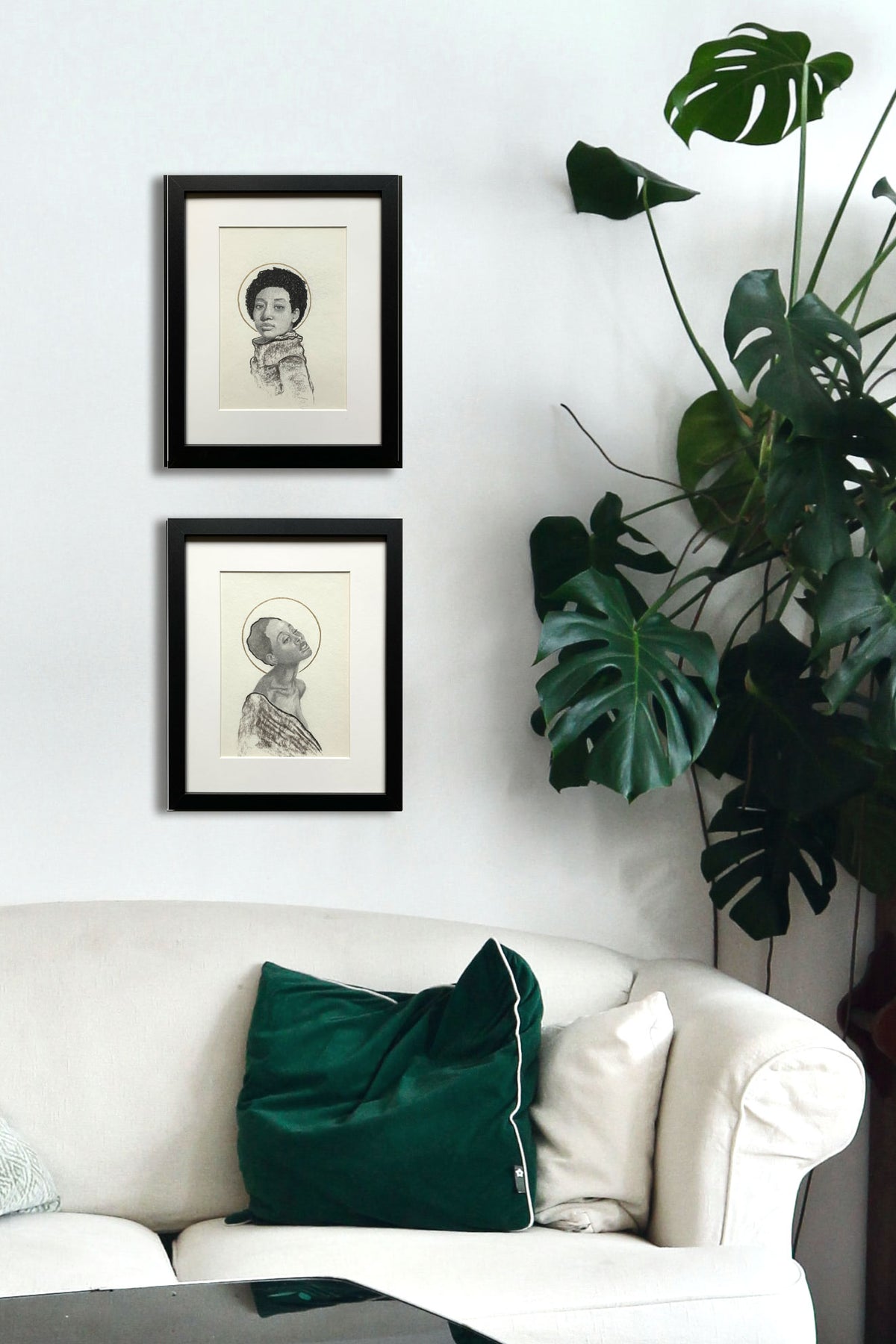 two women portrait drawings on wall
