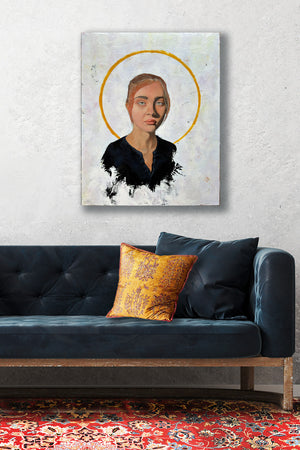 female portrait painting with halo hanging over sofa