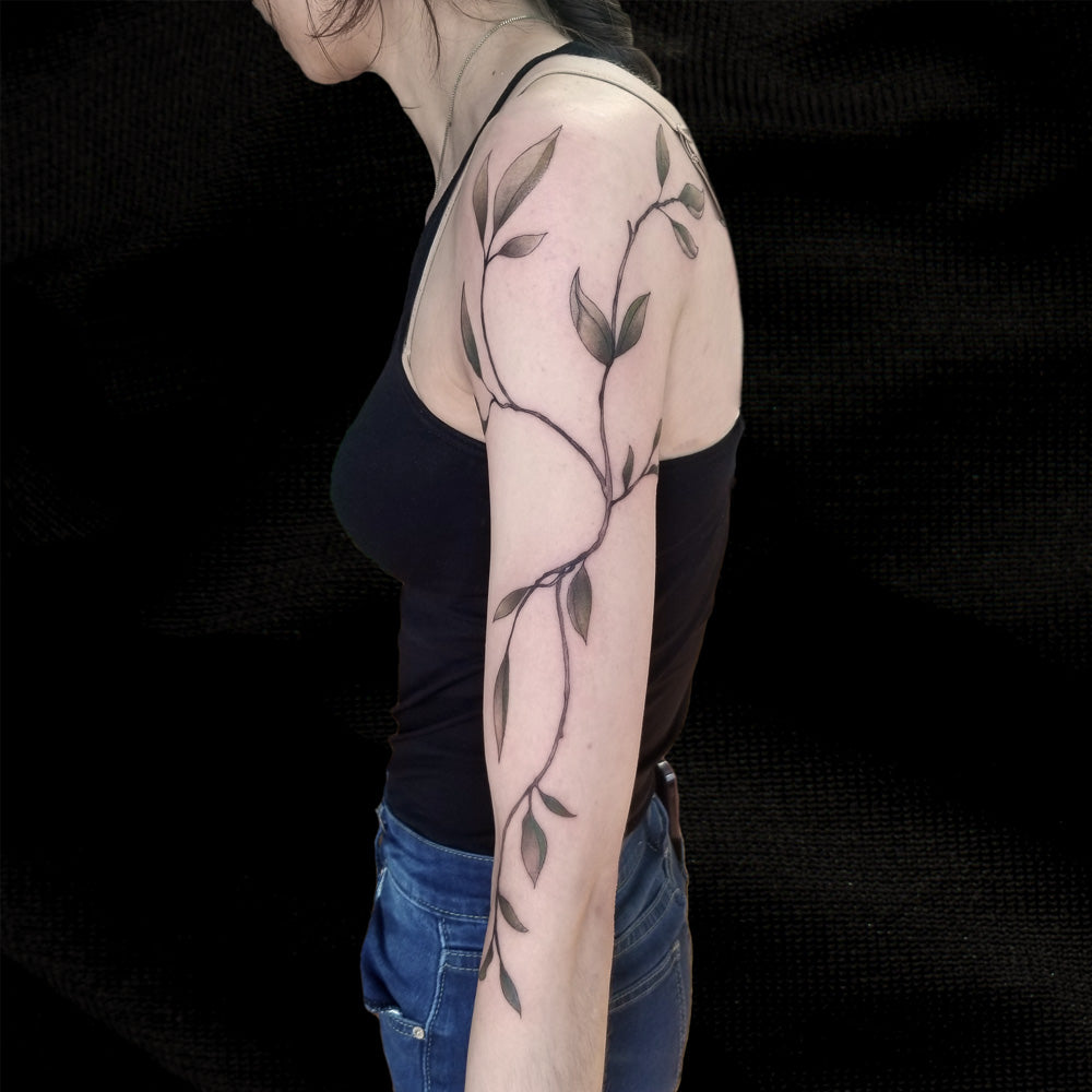 vine arm tattoo by Lydia Pitts