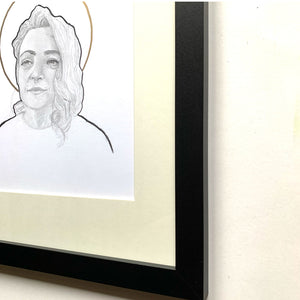 woman face drawing in black frame
