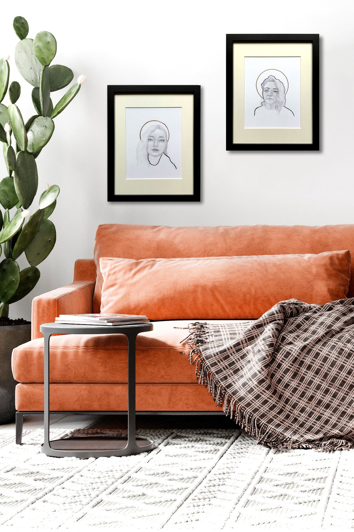 portrait drawings pair over orange sofa
